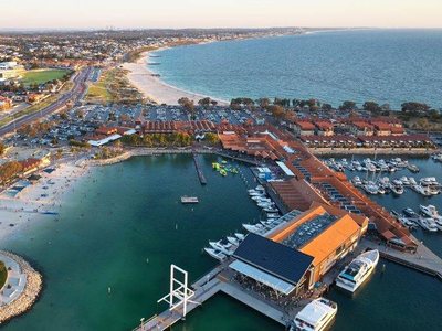Hillarys Boat Harbour at dusk, with the coast running south
