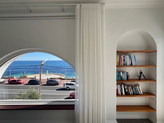 Arched window and bookshelf niche in the main bedroom