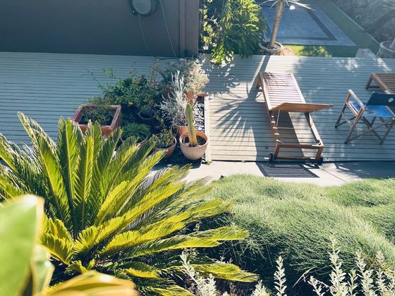 Sun lounger and deck chair on the garden deck